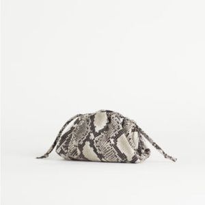 Mini snake print clutch crossbody bag